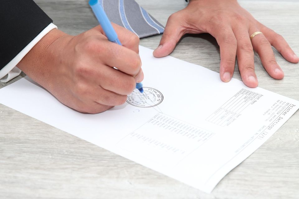 Signing and stamping an official document