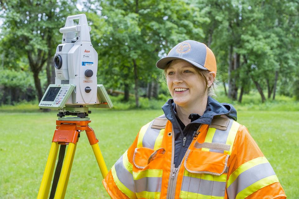 A surveyor reading a positioning instrument in the field